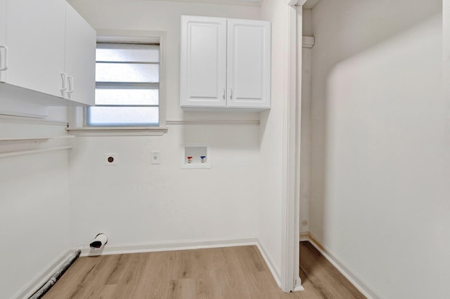 clothes washing area featuring hookup for a washing machine, baseboards, light wood-style floors, and hookup for an electric dryer