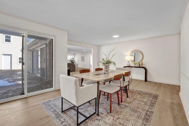 dining space with recessed lighting and wood finished floors