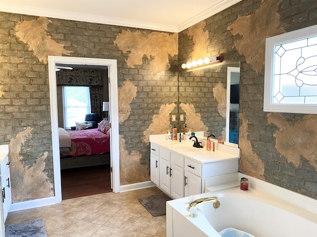 ensuite bathroom with a garden tub, vanity, baseboards, ensuite bath, and crown molding