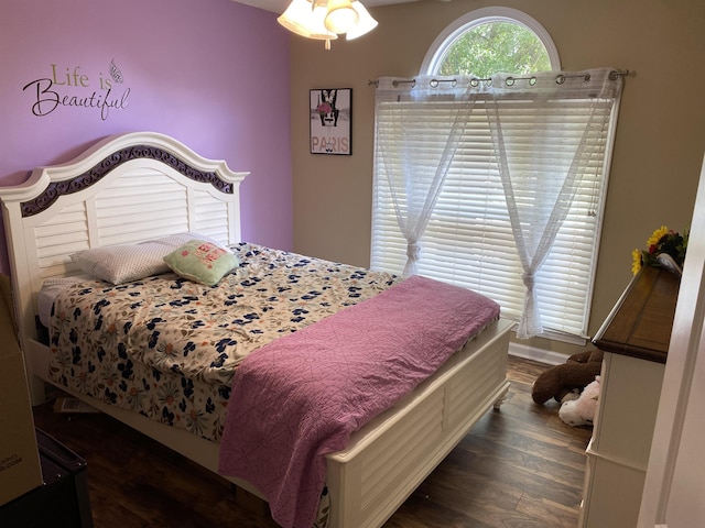 bedroom with wood finished floors