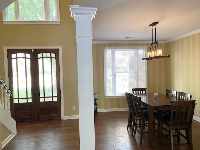 dining space featuring crown molding, visible vents, dark wood-type flooring, and french doors