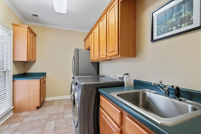 washroom featuring a sink, visible vents, baseboards, ornamental molding, and cabinet space