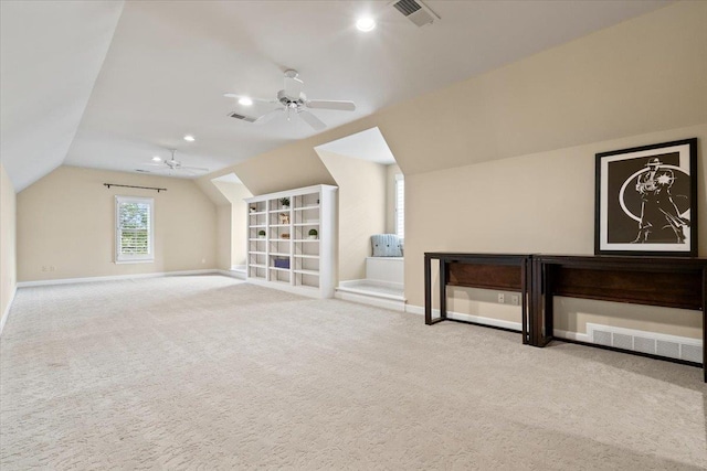 additional living space featuring lofted ceiling, carpet floors, visible vents, and a ceiling fan