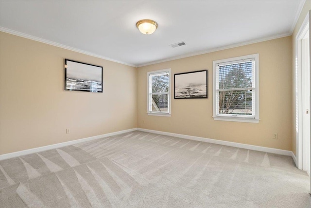 unfurnished room with light colored carpet, crown molding, visible vents, and baseboards