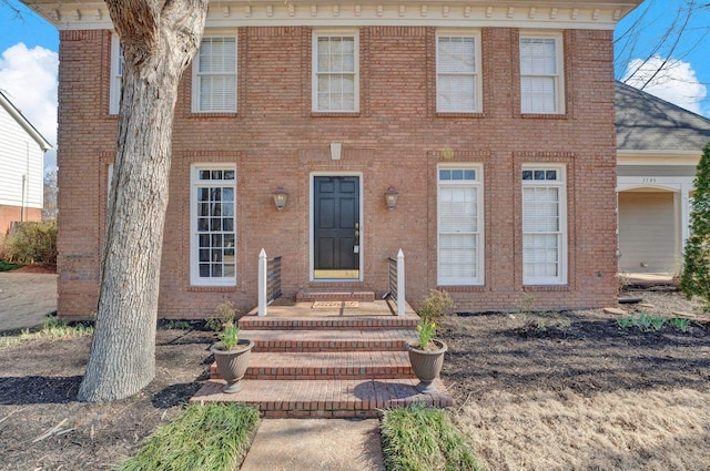 view of front of property featuring brick siding