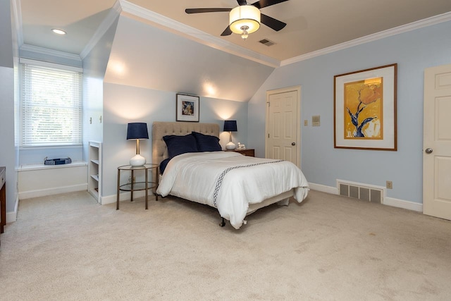 carpeted bedroom with baseboards, visible vents, and crown molding