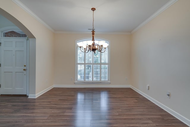 unfurnished dining area with baseboards, arched walkways, dark wood finished floors, ornamental molding, and a notable chandelier