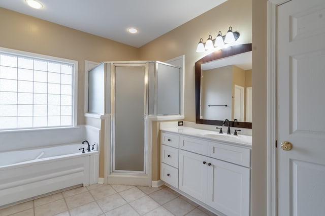 full bathroom with tile patterned flooring, a garden tub, vanity, and a shower stall