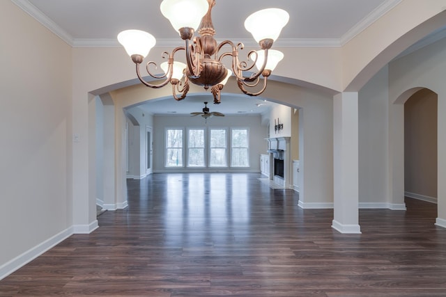 interior space with dark wood-style floors, crown molding, and ceiling fan with notable chandelier