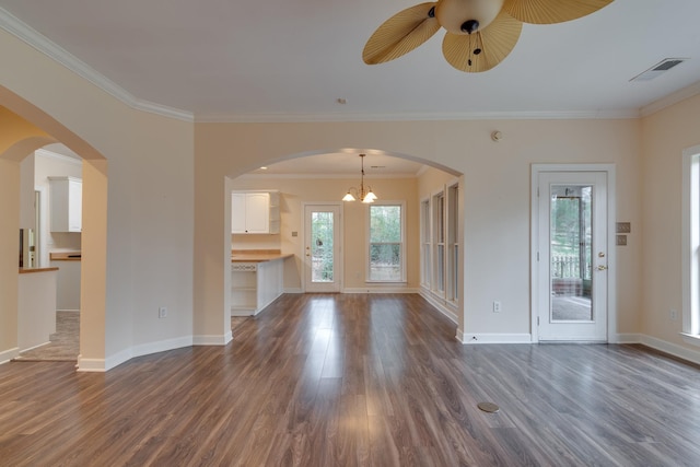 unfurnished living room with visible vents, dark wood finished floors, and ornamental molding