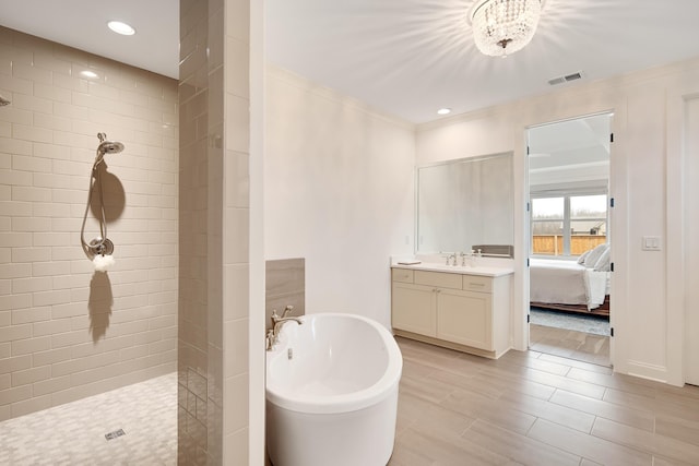 full bathroom featuring a soaking tub, visible vents, ensuite bath, and walk in shower