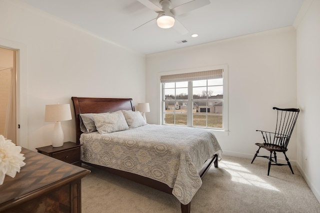 bedroom featuring ceiling fan, carpet flooring, visible vents, baseboards, and ornamental molding