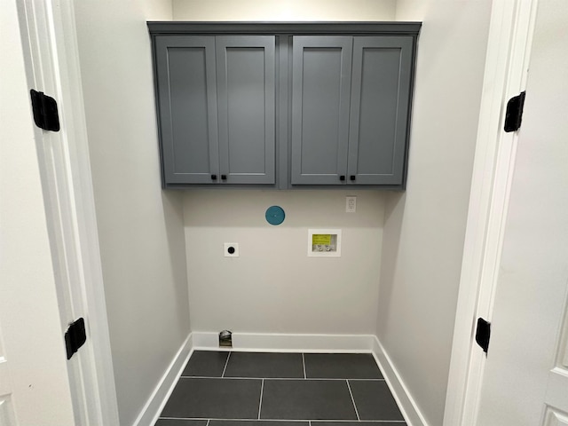 clothes washing area featuring baseboards, hookup for a washing machine, tile patterned floors, and hookup for an electric dryer