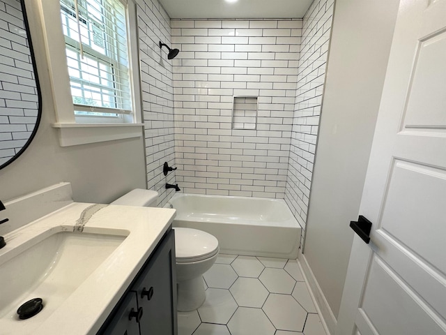 full bathroom featuring shower / bath combination, toilet, vanity, baseboards, and tile patterned floors