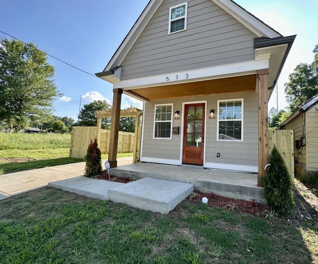 exterior space featuring fence and a lawn