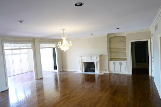 unfurnished living room featuring built in shelves, crown molding, visible vents, a fireplace with flush hearth, and dark wood-type flooring