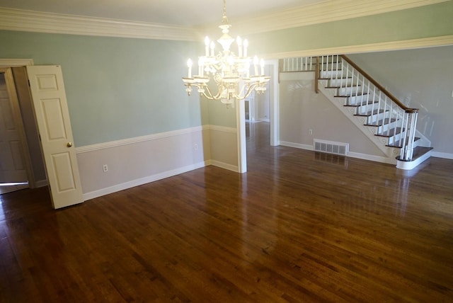 spare room featuring visible vents, baseboards, stairway, wood finished floors, and a notable chandelier