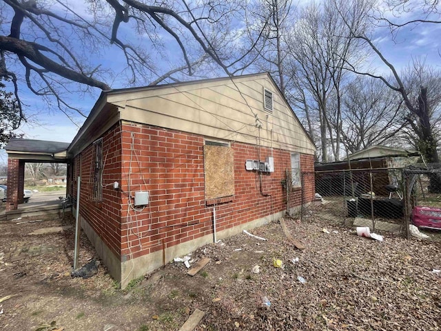 view of property exterior with brick siding