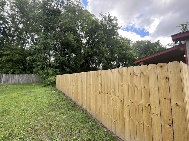 view of yard featuring fence