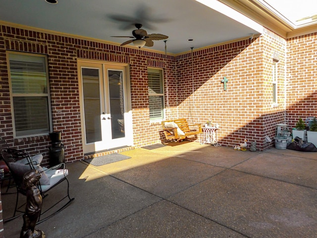 view of patio / terrace with ceiling fan and french doors