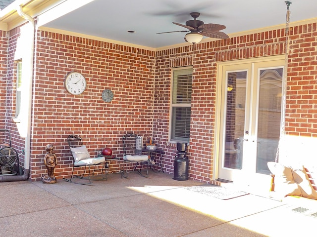 view of patio featuring a ceiling fan and french doors