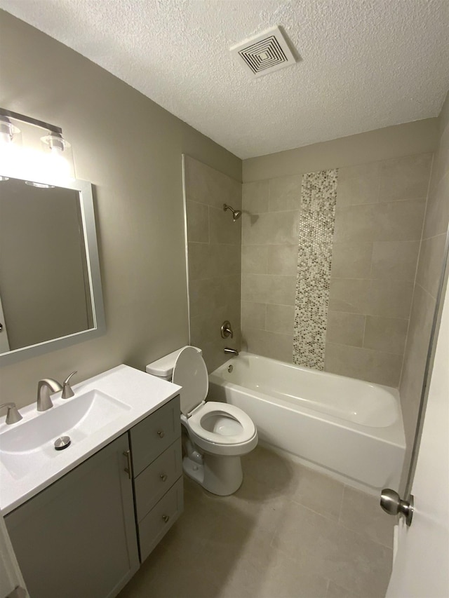 full bath featuring a textured ceiling, toilet, bathing tub / shower combination, vanity, and visible vents