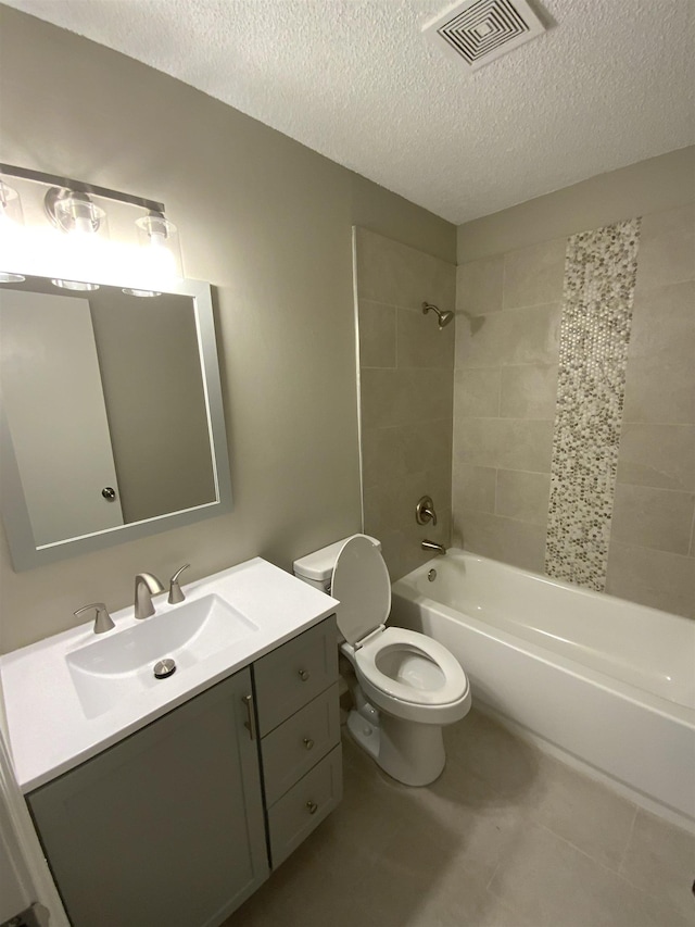 bathroom featuring toilet, shower / bath combination, a textured ceiling, and visible vents