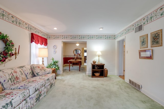 living room with carpet floors, baseboards, visible vents, and ornamental molding