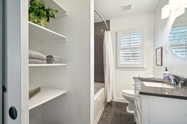 bathroom featuring tile patterned flooring, toilet, vanity, visible vents, and shower / bathtub combination with curtain