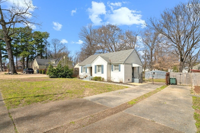 bungalow-style home with driveway, crawl space, a gate, fence, and a front yard