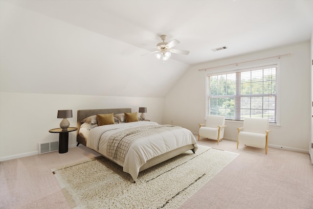 bedroom featuring lofted ceiling, visible vents, and carpet flooring