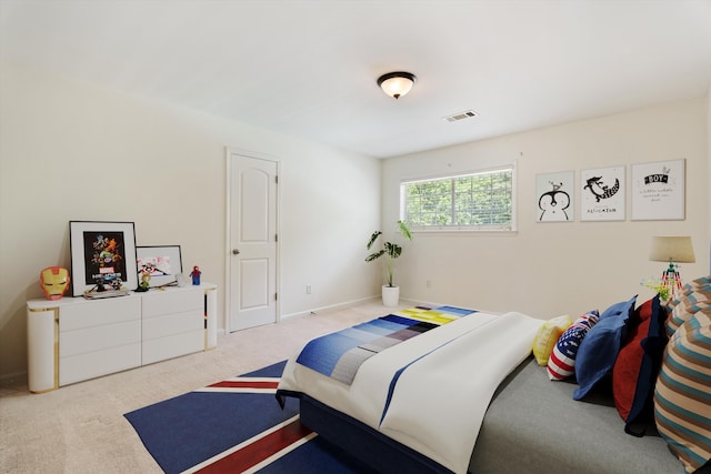 bedroom with carpet, visible vents, and baseboards