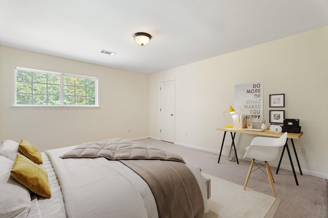 bedroom with carpet floors, visible vents, and baseboards