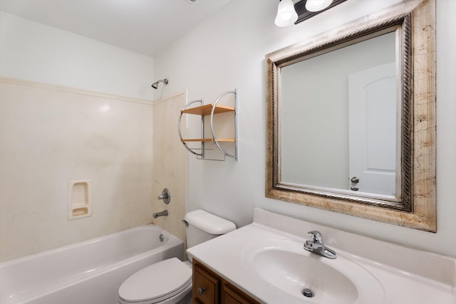 bathroom featuring toilet, shower / washtub combination, and vanity