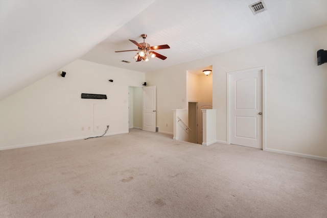 interior space featuring visible vents, ceiling fan, light carpet, and baseboards