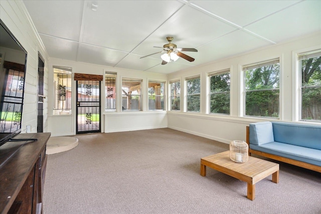 sunroom / solarium featuring ceiling fan