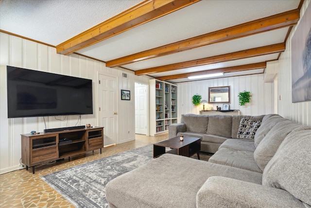 living room with visible vents and beam ceiling