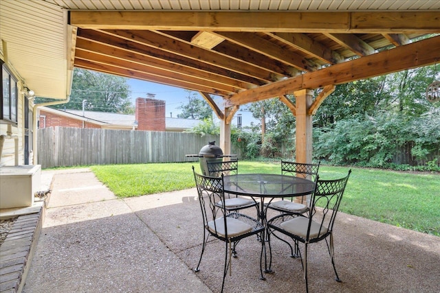 view of patio / terrace featuring fence, area for grilling, and outdoor dining space