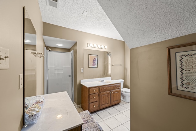 full bathroom with visible vents, toilet, a stall shower, vanity, and tile patterned flooring