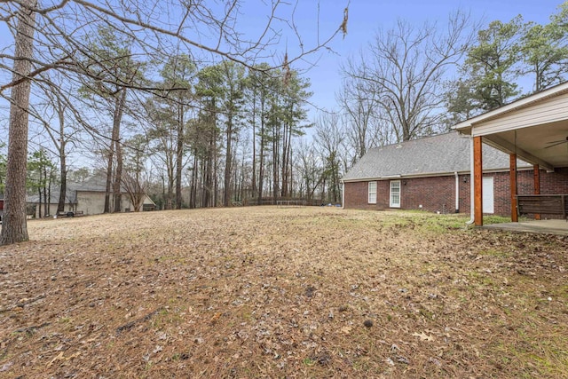 view of yard featuring ceiling fan