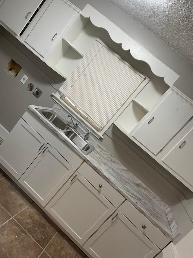 kitchen with light countertops and a sink