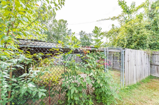 view of gate featuring fence