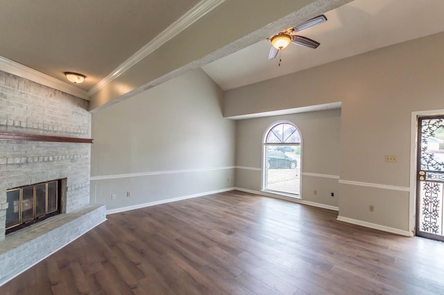 unfurnished living room with ornamental molding, a fireplace, baseboards, and wood finished floors