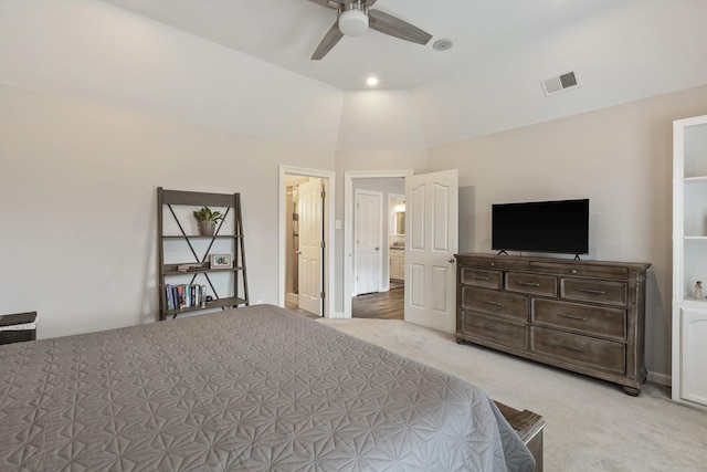 bedroom featuring light carpet, ceiling fan, visible vents, and vaulted ceiling