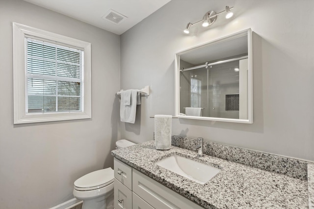 full bath featuring visible vents, baseboards, toilet, vanity, and a shower stall