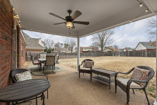 view of patio / terrace featuring ceiling fan, outdoor dining area, and a fenced backyard