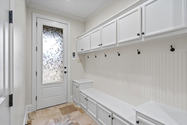 mudroom featuring stone finish flooring and ornamental molding