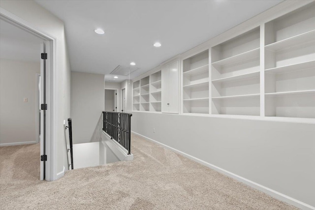 corridor featuring recessed lighting, carpet flooring, an upstairs landing, baseboards, and attic access