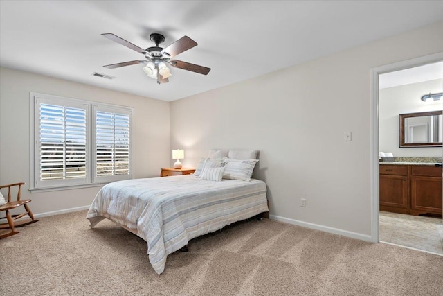 bedroom featuring light carpet, baseboards, visible vents, and a ceiling fan