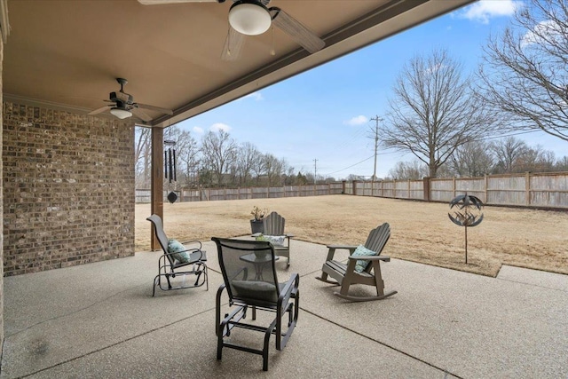 view of patio / terrace with a fenced backyard and a ceiling fan